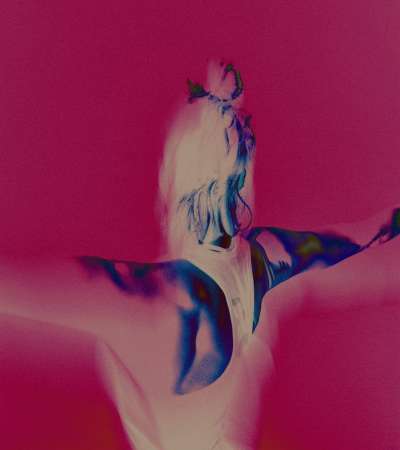 sportclub het eiland photography2 by daniil lavrovski and twice shy feating a lady with her back turned to the camera, doing a yoga pose